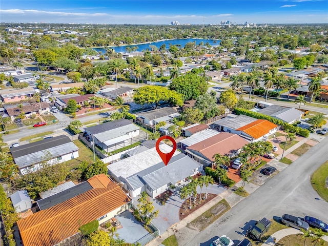 birds eye view of property with a residential view and a water view