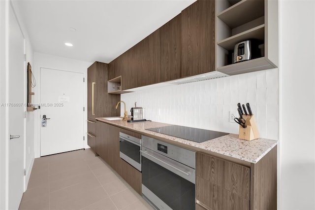 601 NE 1st Ave Unit 4814, Miami, FL 33132 - kitchen with open shelves, stainless steel oven, black electric cooktop, and modern cabinets