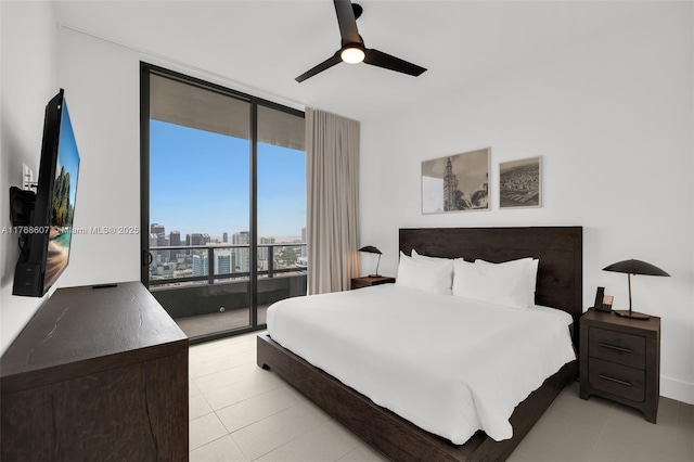 601 NE 1st Ave Unit 4814, Miami, FL 33132 - bedroom with access to exterior, a wall of windows, light tile patterned flooring, a city view, and ceiling fan