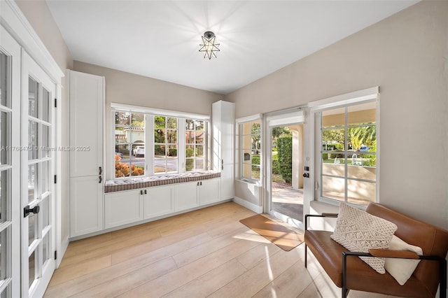 interior space with french doors and light wood-type flooring