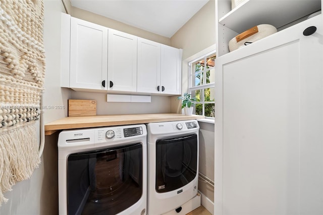 laundry room featuring cabinet space and independent washer and dryer
