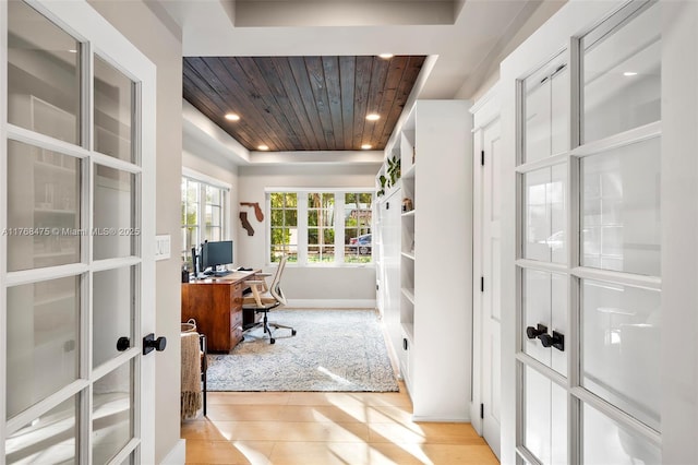 home office with baseboards, recessed lighting, a tray ceiling, french doors, and wood ceiling