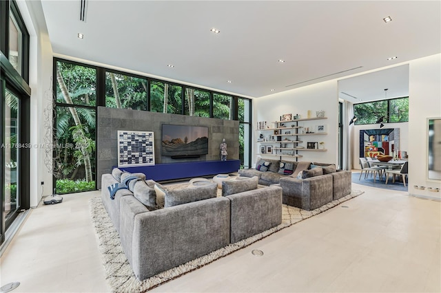 4780 SW 86th Ter, Miami, FL 33143 - living area featuring a wall of windows and recessed lighting