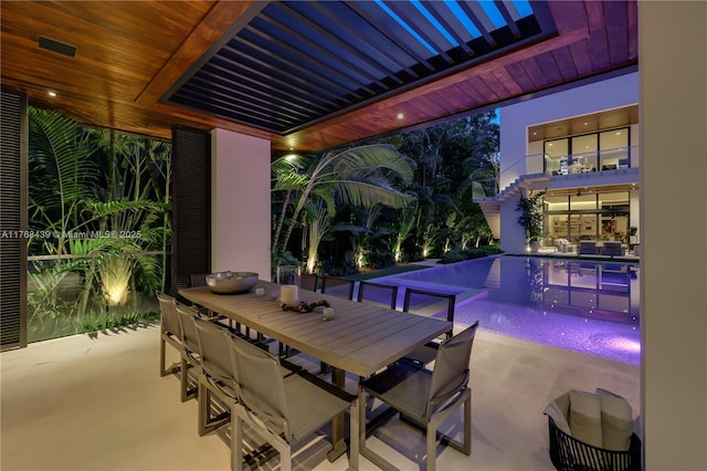 4780 SW 86th Ter, Miami, FL 33143 - view of patio / terrace with an outdoor pool, outdoor dining area, and a balcony