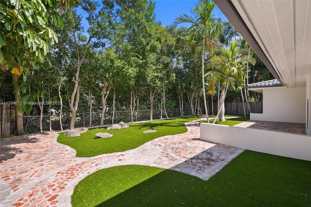 1221 NE 87th St, Miami, FL 33138 - view of yard featuring a fenced backyard and a patio area