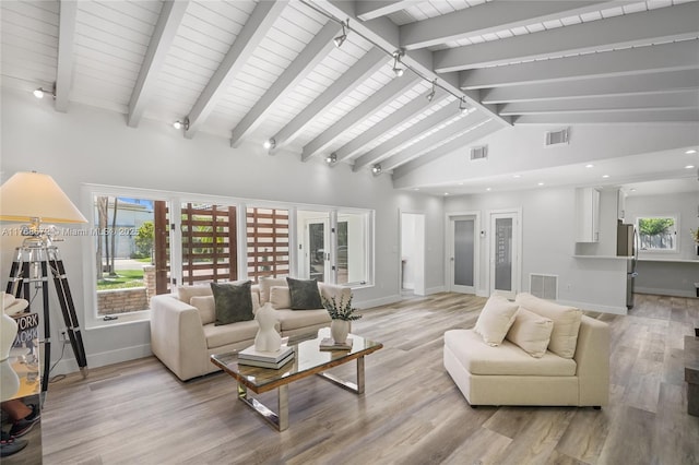 1221 NE 87th St, Miami, FL 33138 - living area featuring light wood finished floors, beam ceiling, and visible vents