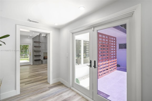 1221 NE 87th St, Miami, FL 33138 - entryway with baseboards, french doors, light wood-type flooring, and visible vents