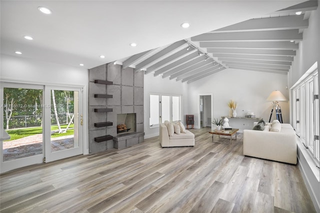 1221 NE 87th St, Miami, FL 33138 - living area featuring vaulted ceiling with beams, recessed lighting, light wood-style flooring, and a large fireplace