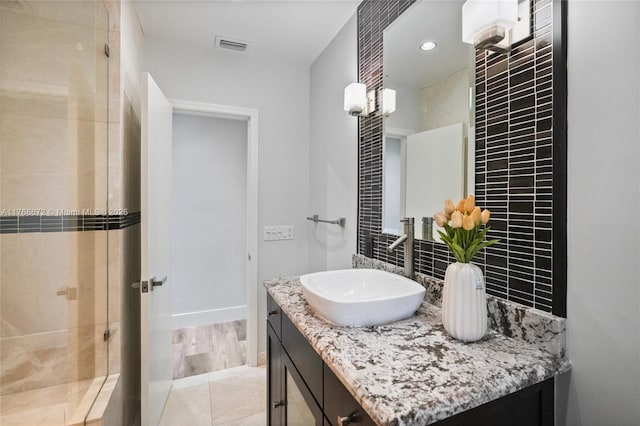 1221 NE 87th St, Miami, FL 33138 - bathroom with visible vents, tasteful backsplash, a tile shower, vanity, and baseboards