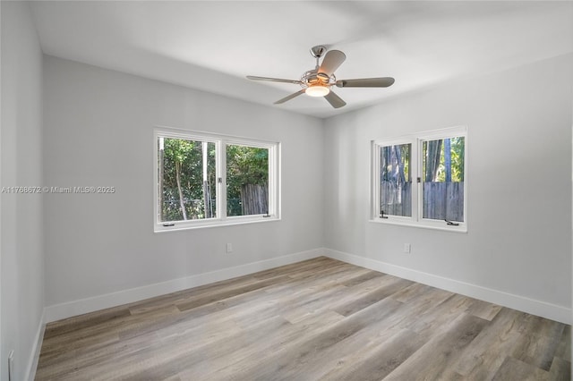 1221 NE 87th St, Miami, FL 33138 - spare room with baseboards, a ceiling fan, and wood finished floors