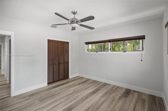 1221 NE 87th St, Miami, FL 33138 - unfurnished bedroom with a ceiling fan, baseboards, wood finished floors, visible vents, and a closet