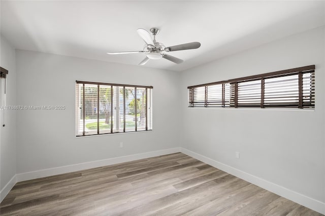 1221 NE 87th St, Miami, FL 33138 - empty room with light wood-style floors, baseboards, and ceiling fan