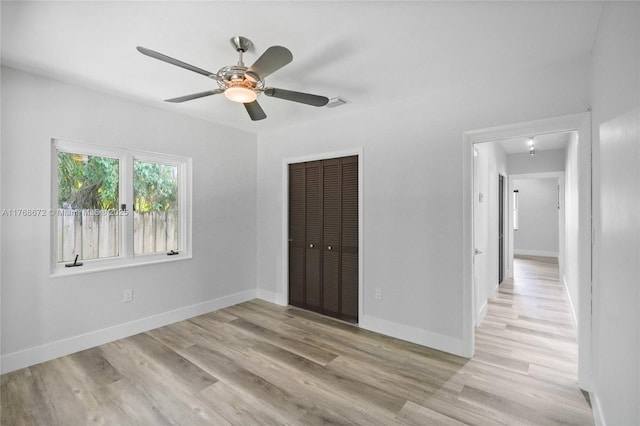 1221 NE 87th St, Miami, FL 33138 - unfurnished bedroom featuring a closet, light wood finished floors, ceiling fan, and baseboards