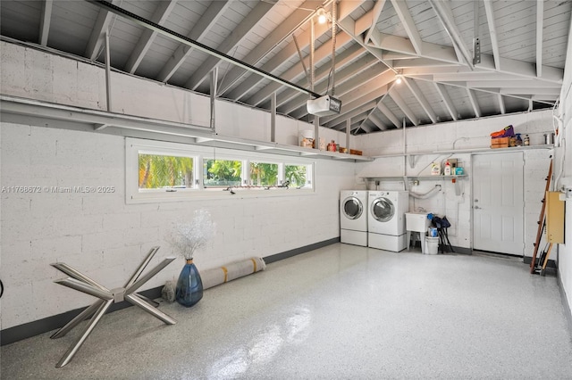 1221 NE 87th St, Miami, FL 33138 - garage with washer and dryer, concrete block wall, and a garage door opener