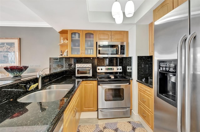 kitchen with decorative backsplash, ornamental molding, stainless steel appliances, glass insert cabinets, and a sink