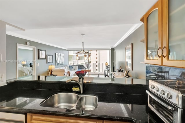 kitchen with ornamental molding, a sink, dark stone counters, and stainless steel electric stove
