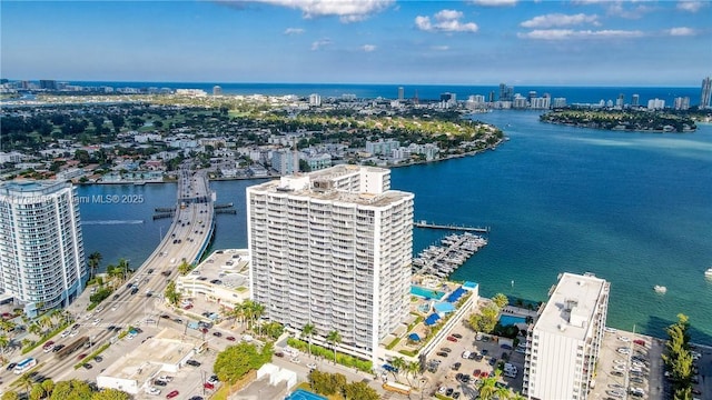 drone / aerial view featuring a water view and a city view