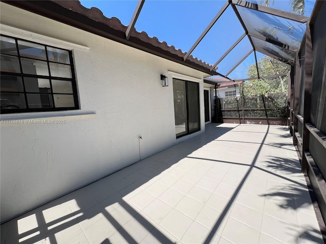 view of patio with a lanai