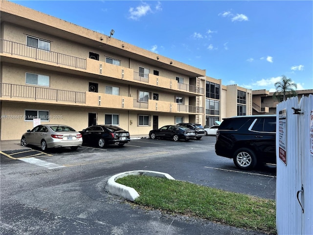 view of property with uncovered parking