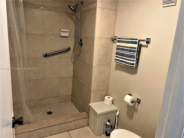 full bath with visible vents, tile patterned floors, a stall shower, and toilet