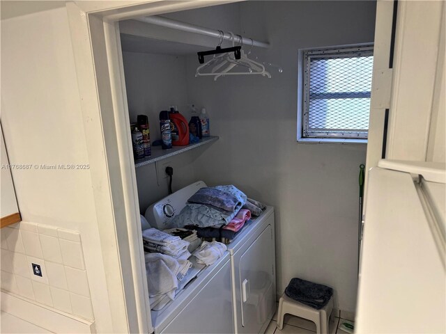 laundry area featuring laundry area and washing machine and dryer