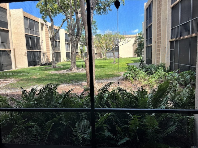 view of community featuring a yard