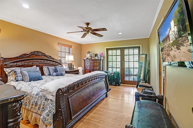 bedroom with multiple windows, crown molding, and light wood finished floors