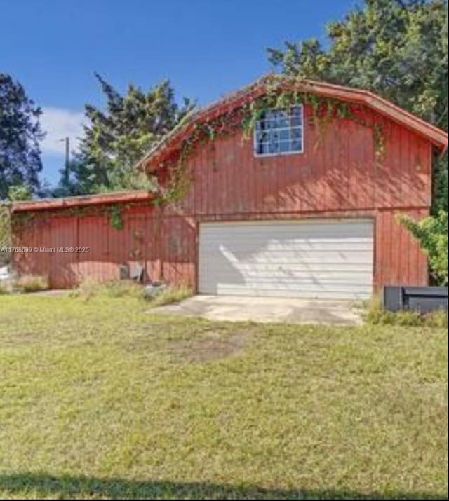 garage featuring driveway and a garage