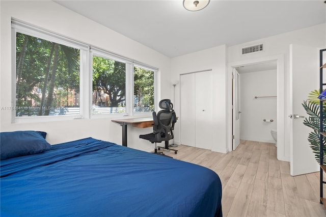 740 Meridian Ave Unit 11, Miami Beach, FL 33139 - bedroom with light wood-type flooring and a closet