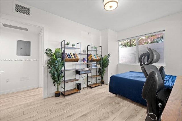 740 Meridian Ave Unit 11, Miami Beach, FL 33139 - bedroom featuring electric panel, wood finished floors, and baseboards