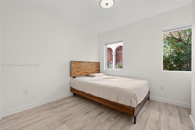 740 Meridian Ave Unit 11, Miami Beach, FL 33139 - bedroom featuring light wood finished floors and baseboards