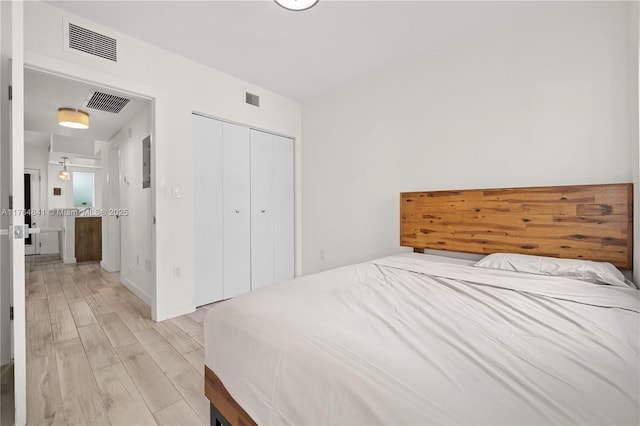 740 Meridian Ave Unit 11, Miami Beach, FL 33139 - bedroom featuring light wood finished floors and a closet