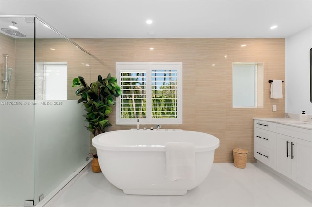 13453 SW 58th Ave, Pinecrest, FL 33156 - full bathroom featuring a shower stall, a freestanding tub, vanity, tile walls, and recessed lighting