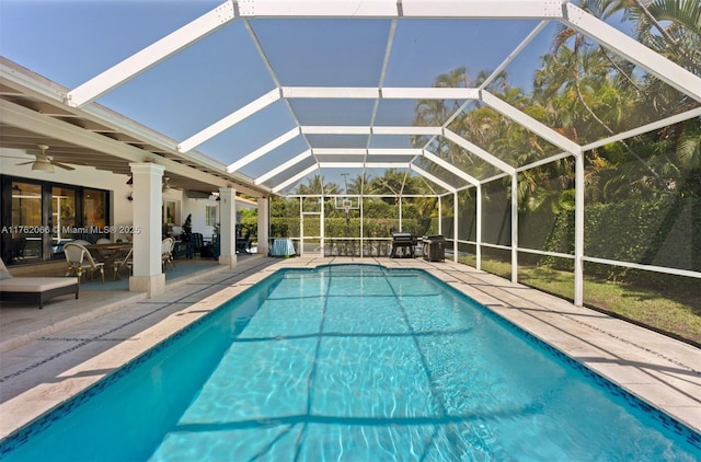 13453 SW 58th Ave, Pinecrest, FL 33156 - outdoor pool with a ceiling fan, a patio, and glass enclosure