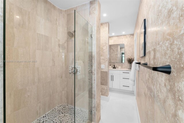 13453 SW 58th Ave, Pinecrest, FL 33156 - bathroom featuring walk in shower, vanity, tile walls, and recessed lighting