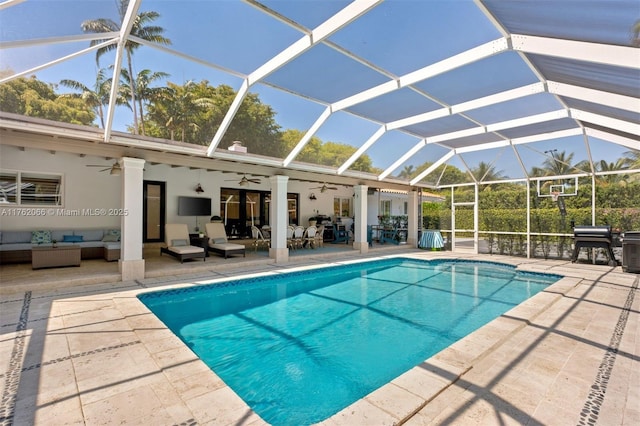 13453 SW 58th Ave, Pinecrest, FL 33156 - swimming pool featuring an outdoor living space, a ceiling fan, a patio area, and glass enclosure