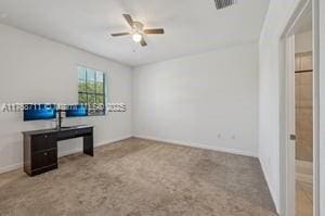 interior space with ceiling fan and visible vents