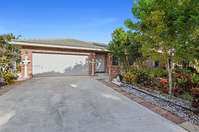ranch-style house with brick siding, driveway, and a garage