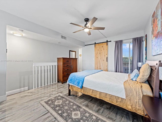 820 NW 87th Ave Unit 409, Miami, FL 33172 - bedroom featuring visible vents, a ceiling fan, and a barn door