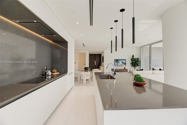 300 Biscayne Blvd Way Unit 3707, Miami, FL 33131 - kitchen with a kitchen island with sink, a sink, white cabinets, pendant lighting, and modern cabinets