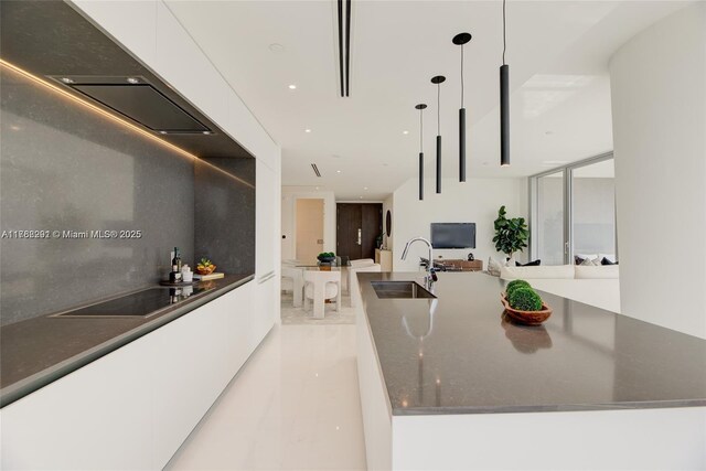 300 Biscayne Blvd Way Unit 3707, Miami, FL 33131 - kitchen with a center island with sink, hanging light fixtures, white cabinets, modern cabinets, and a sink