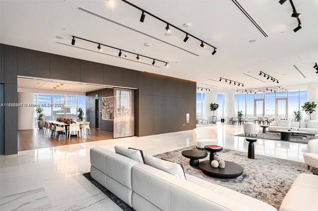 300 Biscayne Blvd Way Unit 3707, Miami, FL 33131 - living room featuring marble finish floor, rail lighting, and a healthy amount of sunlight