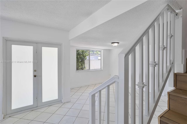 3524 NW 4th Ter, Miami, FL 33125 - interior space featuring light tile patterned flooring, french doors, and a textured ceiling