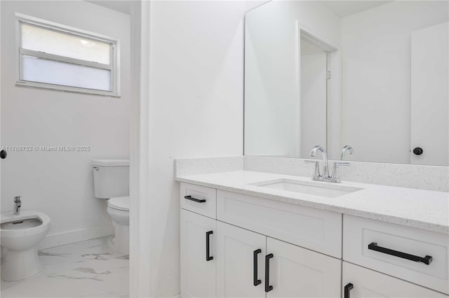 3524 NW 4th Ter, Miami, FL 33125 - bathroom with vanity, a bidet, baseboards, toilet, and marble finish floor