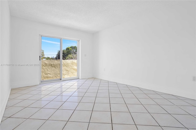 3524 NW 4th Ter, Miami, FL 33125 - unfurnished room featuring light tile patterned floors and a textured ceiling