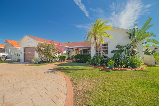 5950 NW 192nd St, Hialeah, FL 33015 - ranch-style house with a garage, a front yard, decorative driveway, and stucco siding