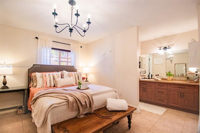 5950 NW 192nd St, Hialeah, FL 33015 - bedroom featuring light tile patterned flooring, a chandelier, and connected bathroom