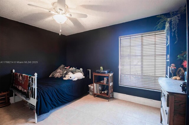 5950 NW 192nd St, Hialeah, FL 33015 - bedroom with tile patterned floors, ceiling fan, and baseboards