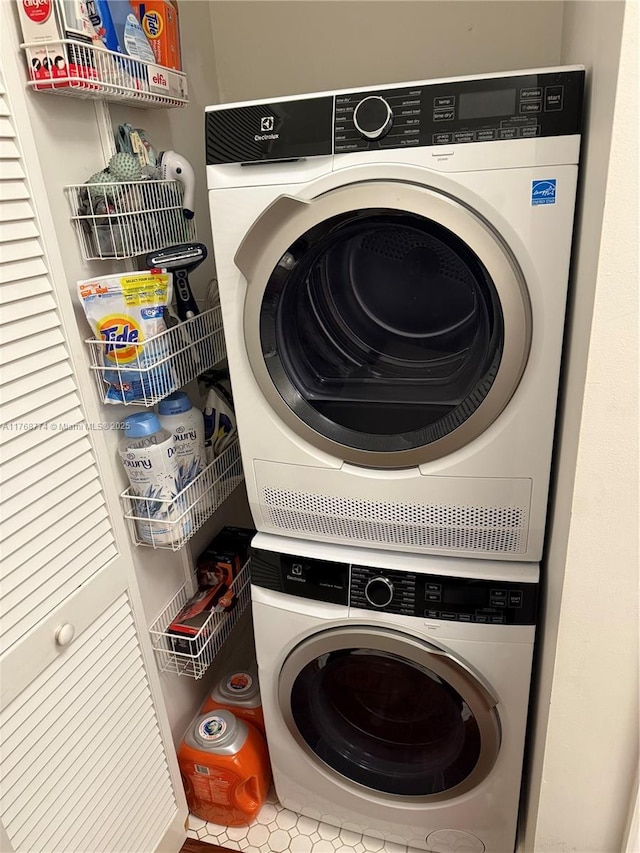 laundry area with laundry area and stacked washing maching and dryer