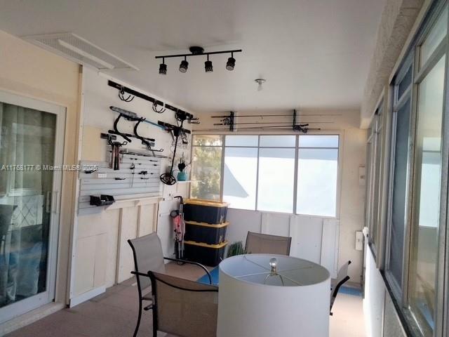 410 SW Natura Ave, Deerfield Beach, FL 33441 - sunroom featuring rail lighting